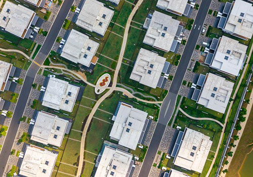 Top down view of apartment complex with curved sidewalks