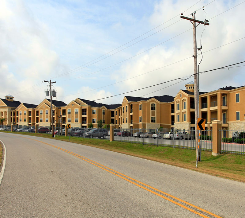 2-story beige affordable housing apartments